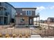 Modern two-story home with private backyard and wooden fence at 6020 N Orleans St, Aurora, CO 80019
