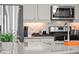 Modern kitchen with stainless steel appliances and white cabinets at 6020 N Orleans St, Aurora, CO 80019