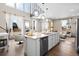 Open concept kitchen with island and stainless steel appliances at 6020 N Orleans St, Aurora, CO 80019
