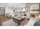 Bright and airy living room with comfortable seating and large windows at 6020 N Orleans St, Aurora, CO 80019