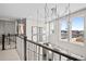 Spacious upper landing with natural light and stylish chandelier at 6020 N Orleans St, Aurora, CO 80019