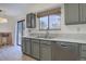 Well-lit kitchen featuring stainless steel appliances, ample counter space, and modern fixtures at 1602 S Lewiston St, Aurora, CO 80017