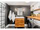 Modern bathroom boasts dark accent walls, a stylish vanity, and a glass-enclosed shower at 2900 Clermont St, Denver, CO 80207