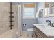 Clean bathroom featuring tile floors, a shower with tile surround, and modern fixtures at 2900 Clermont St, Denver, CO 80207