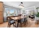 Charming dining room with modern chandelier, wooden table with seating for six, and lots of natural light at 2900 Clermont St, Denver, CO 80207