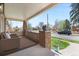 Charming front porch with comfortable seating and a view of the neighborhood at 2900 Clermont St, Denver, CO 80207