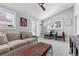 Bright living room featuring comfortable seating, a vaulted ceiling, and natural light from large windows and French doors at 2900 Clermont St, Denver, CO 80207