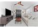 Bright living room featuring a ceiling fan, entertainment center, and comfortable seating, perfect for relaxation at 2900 Clermont St, Denver, CO 80207