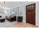 Inviting living room featuring hardwood floors and a cozy leather sofa at 2900 Clermont St, Denver, CO 80207