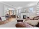 Spacious living room showcasing a fireplace, hardwood floors, and open-concept design at 2900 Clermont St, Denver, CO 80207