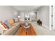 Inviting living room features a comfortable sectional sofa, stylish decor, and access to the upper level at 2900 Clermont St, Denver, CO 80207