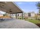 A large back patio with a ceiling fan, grassy yard, and view of other homes at 17522 E Dewberry Dr, Parker, CO 80134