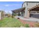 A beautiful backyard featuring an outdoor living area with a ceiling fan and a hot tub at 17522 E Dewberry Dr, Parker, CO 80134