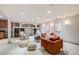 This is a finished basement with seating, shelving and stylish lighting at 17522 E Dewberry Dr, Parker, CO 80134