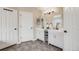 This is a well-lit bathroom with double vanity and tiled floor at 17522 E Dewberry Dr, Parker, CO 80134