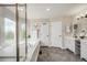 This is a bright bathroom featuring a soaking tub, shower and double vanity at 17522 E Dewberry Dr, Parker, CO 80134