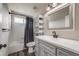 This is a minimalist bathroom featuring modern fixtures and gray color palette at 17522 E Dewberry Dr, Parker, CO 80134