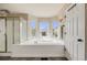 This is a bright bathroom featuring a soaking tub and shower with neighborhood views at 17522 E Dewberry Dr, Parker, CO 80134