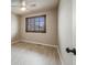 This is a simple bedroom with a ceiling fan and a window with privacy shutters at 17522 E Dewberry Dr, Parker, CO 80134