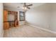 This is a minimal bedroom featuring built-in shelving and a window with privacy shutters at 17522 E Dewberry Dr, Parker, CO 80134