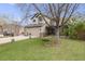 Landscaped front yard with mature trees and swing, adding to the curb appeal of this lovely home at 17522 E Dewberry Dr, Parker, CO 80134