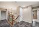 Second-floor hallway with modern flooring, lighting fixtures, and staircase to lower level at 17522 E Dewberry Dr, Parker, CO 80134