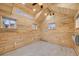 A bright interior features wood-paneled walls, several windows, and ceiling lights at 17522 E Dewberry Dr, Parker, CO 80134