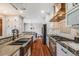Well-equipped kitchen featuring stainless steel appliances, granite countertops, and custom cabinetry at 17522 E Dewberry Dr, Parker, CO 80134