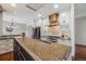 Kitchen with stainless steel appliances, custom cabinets and granite countertops on an island at 17522 E Dewberry Dr, Parker, CO 80134