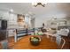 Open concept living room with kitchen, breakfast nook, and fireplace, perfect for entertaining at 17522 E Dewberry Dr, Parker, CO 80134