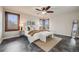 Main bedroom with plantation shutters, modern lighting, and a neutral color palette at 17522 E Dewberry Dr, Parker, CO 80134