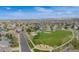 Aerial view of a neighborhood park with playground, basketball court, and green space at 17522 E Dewberry Dr, Parker, CO 80134