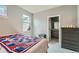Bright bedroom with a view to the ensuite bath at 1284 Stuart St, Denver, CO 80204