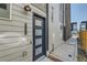 Modern townhome entrance with a stylish black front door and visible house number at 1284 Stuart St, Denver, CO 80204