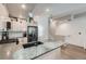 Modern kitchen with stainless steel appliances, gray countertops, and stylish pendant lighting at 1284 Stuart St, Denver, CO 80204