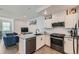 Contemporary kitchen featuring stainless steel appliances, gray countertops, and open layout design at 1284 Stuart St, Denver, CO 80204