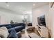Open concept living room with hardwood floors and a dining area at 1284 Stuart St, Denver, CO 80204