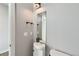 Compact half-bathroom featuring a modern vanity with a vessel sink and minimalist decor at 1284 Stuart St, Denver, CO 80204