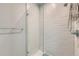Modern shower with subway tile and glass door at 1284 Stuart St, Denver, CO 80204