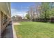 Expansive backyard has a well-maintained lawn and a wood fence at 4728 Dover St, Wheat Ridge, CO 80033