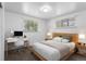 Bright bedroom with a desk, natural light and neutral colored carpet at 4728 Dover St, Wheat Ridge, CO 80033
