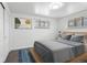 Bedroom with plush carpet, natural light, and neutral wall art and decor at 4728 Dover St, Wheat Ridge, CO 80033