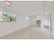Spacious basement with tile floors, two windows, and access to an upper level at 1430 Lashley St, Longmont, CO 80504