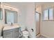 Bathroom featuring a vanity with drawers and a shower with glass doors at 1430 Lashley St, Longmont, CO 80504