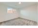 Cozy bedroom with neutral carpet and a window at 1430 Lashley St, Longmont, CO 80504