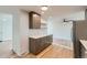 This open kitchenette features modern cabinetry, stylish countertops, and is perfect for casual dining at 1430 Lashley St, Longmont, CO 80504