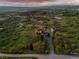 Aerial view of a home on a verdant lot with a long driveway, showcasing the serene and private setting at 3485 Park Ridge Rd, Sedalia, CO 80135