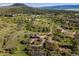 Picture of a red barn amid rolling hills, showing the property's expansive landscape and scenic views at 3485 Park Ridge Rd, Sedalia, CO 80135