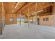 Spacious barn interior with high ceilings, wooden beams, and ample natural light from large openings at 3485 Park Ridge Rd, Sedalia, CO 80135
