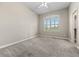 Neutral bedroom with a ceiling fan and bright windows showcasing picturesque scenery at 3485 Park Ridge Rd, Sedalia, CO 80135